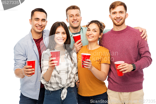 Image of group of smiling friends with drinks in party cups