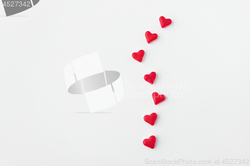 Image of close up of red and pink heart shaped candies