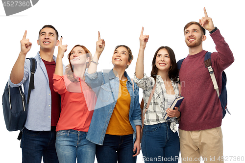 Image of group of happy students pointing fingers up