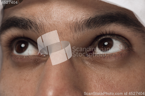 Image of Arabian saudi man on dark blue studio background