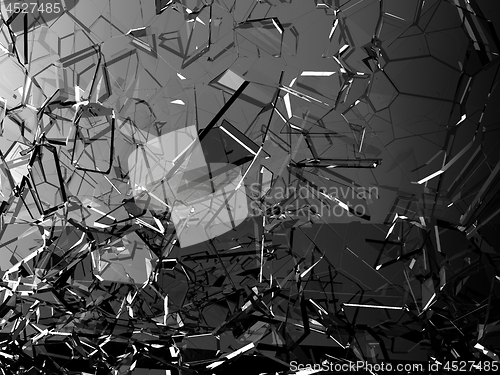 Image of Pieces of glass shattered or cracked on black