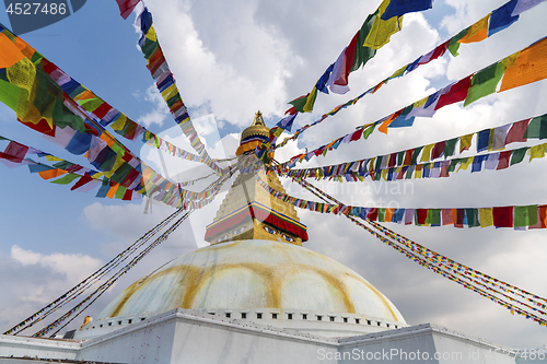 Image of Boudhanath Stupa in Kathmandu and buddhist prayer flags