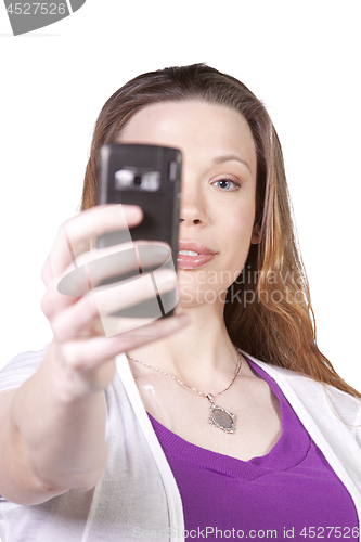 Image of Woman taking  pictures from her cell phone