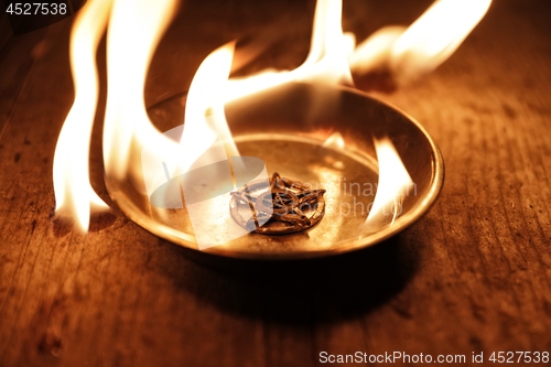 Image of Old pentagram burning in flames