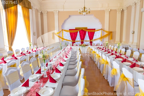 Image of Large dining hall with tables set up