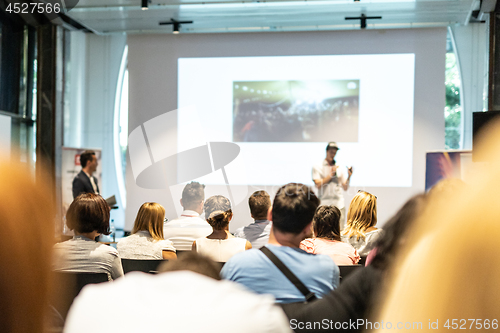 Image of Male business speaker giving a talk at business conference event.