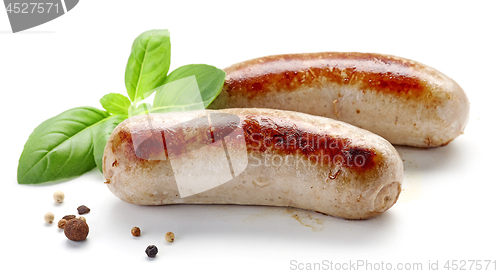 Image of grilled sausages on white background