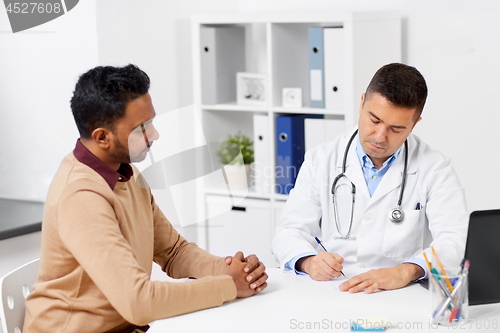 Image of doctor and male patient meeting at clinic