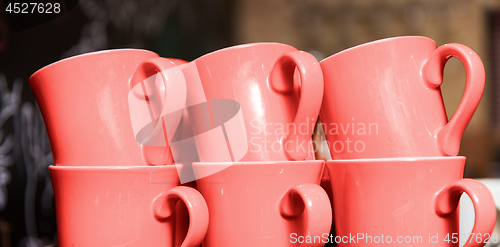 Image of six stacked cups in trendy living coral color