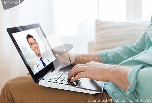 Image of patient having video call with doctor on laptop