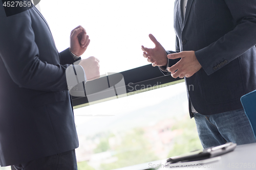 Image of cloasing the deal in modern office interior