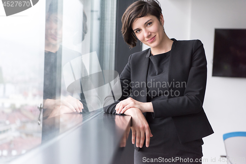 Image of Portrait of successful Businesswoman by the window