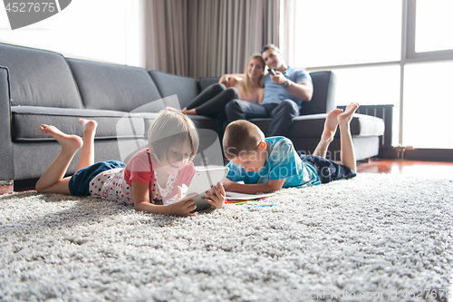 Image of young couple spending time with kids