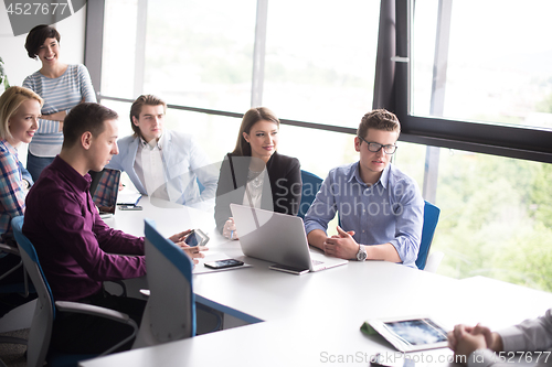Image of Business Team At A Meeting at modern office building