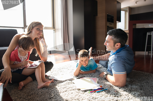 Image of young couple spending time with kids