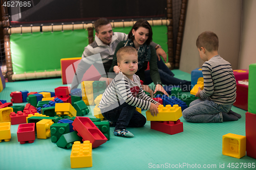 Image of parents having fun with kids