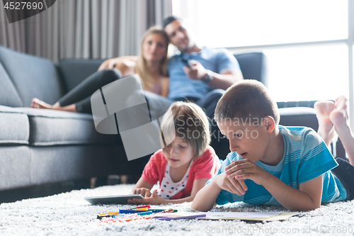 Image of young couple spending time with kids