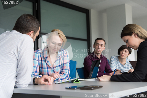 Image of Business Team At A Meeting at modern office building