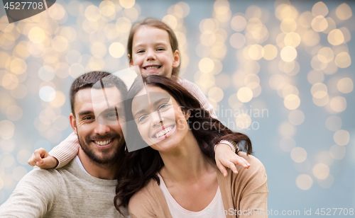 Image of happy family over festive lights background