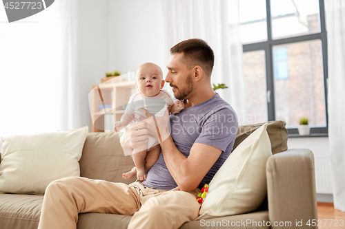 Image of father with little baby girl at home