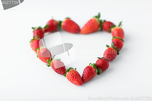 Image of heart shape made of strawberries