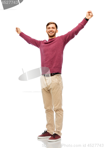 Image of happy young man celebrating success