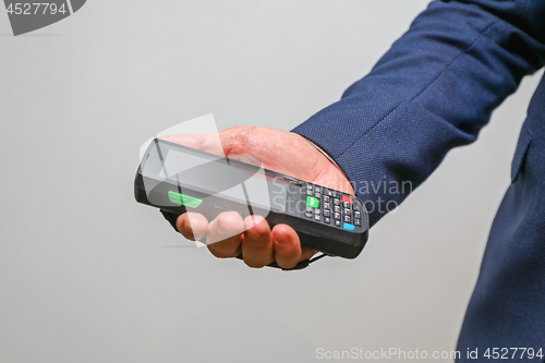 Image of Man Holding Portable Computer