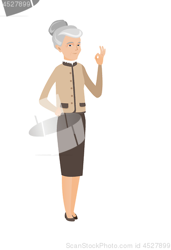 Image of Senior caucasian business woman showing ok sign