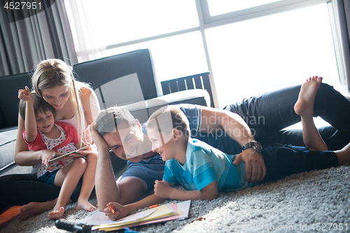 Image of young couple spending time with kids