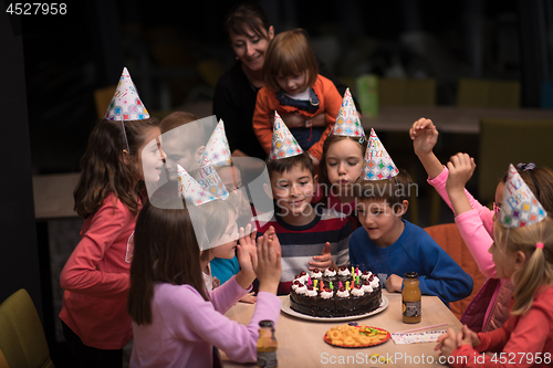 Image of The young boy joyfully celebrating his birthday