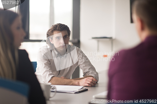 Image of Group of young people meeting in startup office