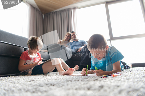 Image of young couple spending time with kids