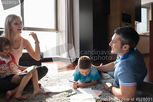 Image of young couple spending time with kids