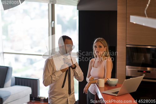 Image of A young couple is preparing for a job and using a laptop