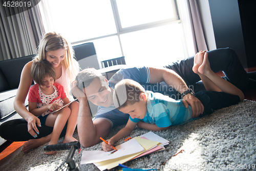Image of young couple spending time with kids