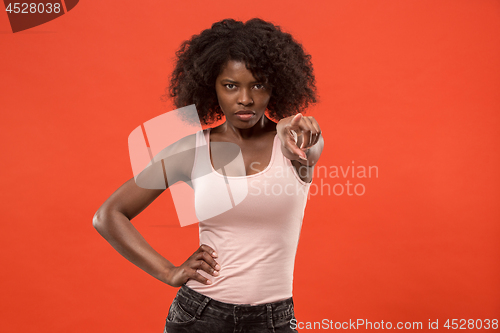 Image of The overbearing business woman point you and want you, half length closeup portrait on red background.