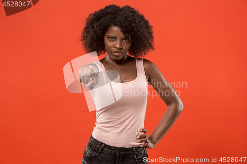 Image of The overbearing business woman point you and want you, half length closeup portrait on red background.