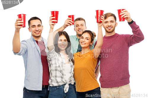 Image of group of smiling friends with drinks in party cups