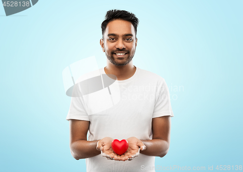 Image of smiling indian man with red heart over grey