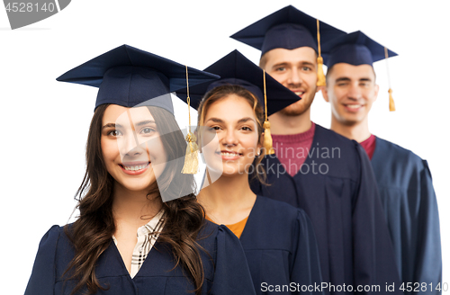 Image of graduates in mortar boards and bachelor gowns