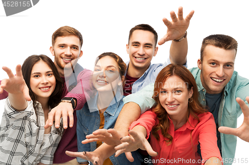 Image of group of happy students over white background