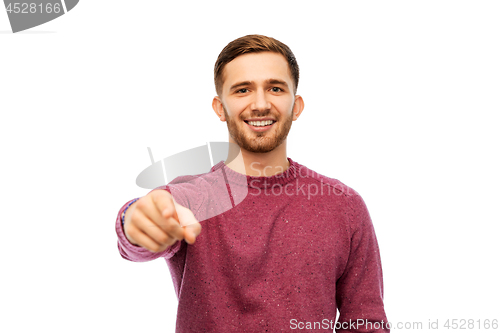 Image of man pointing finger to you over white background