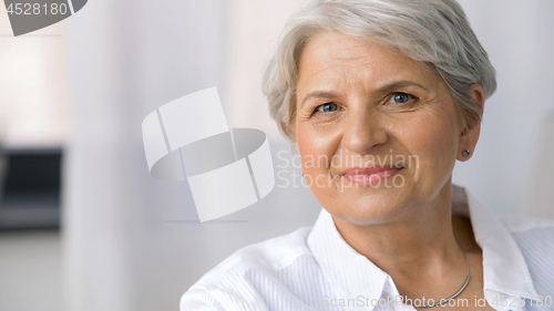 Image of portrait of smiling senior woman