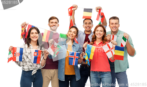 Image of happy friends with flags of different countries