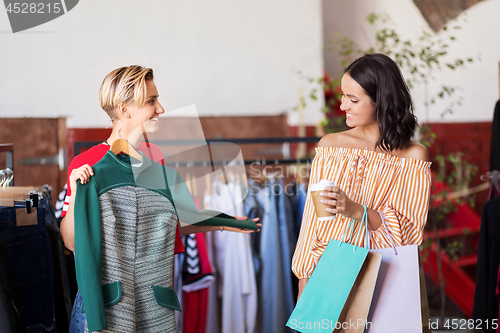 Image of women choosing clothes at vintage clothing store