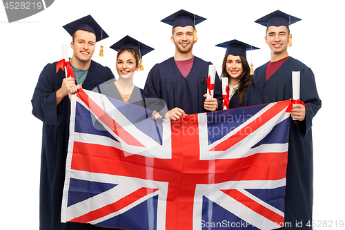 Image of graduate students with diplomas and british flag