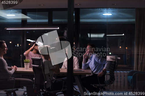 Image of Multiethnic Business team using virtual reality headset