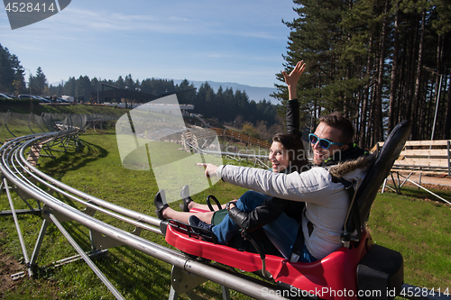 Image of couple enjoys driving on alpine coaster