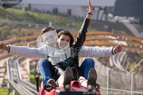 Image of couple enjoys driving on alpine coaster