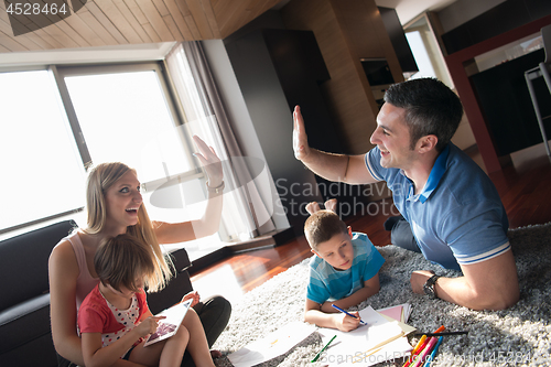 Image of young couple spending time with kids